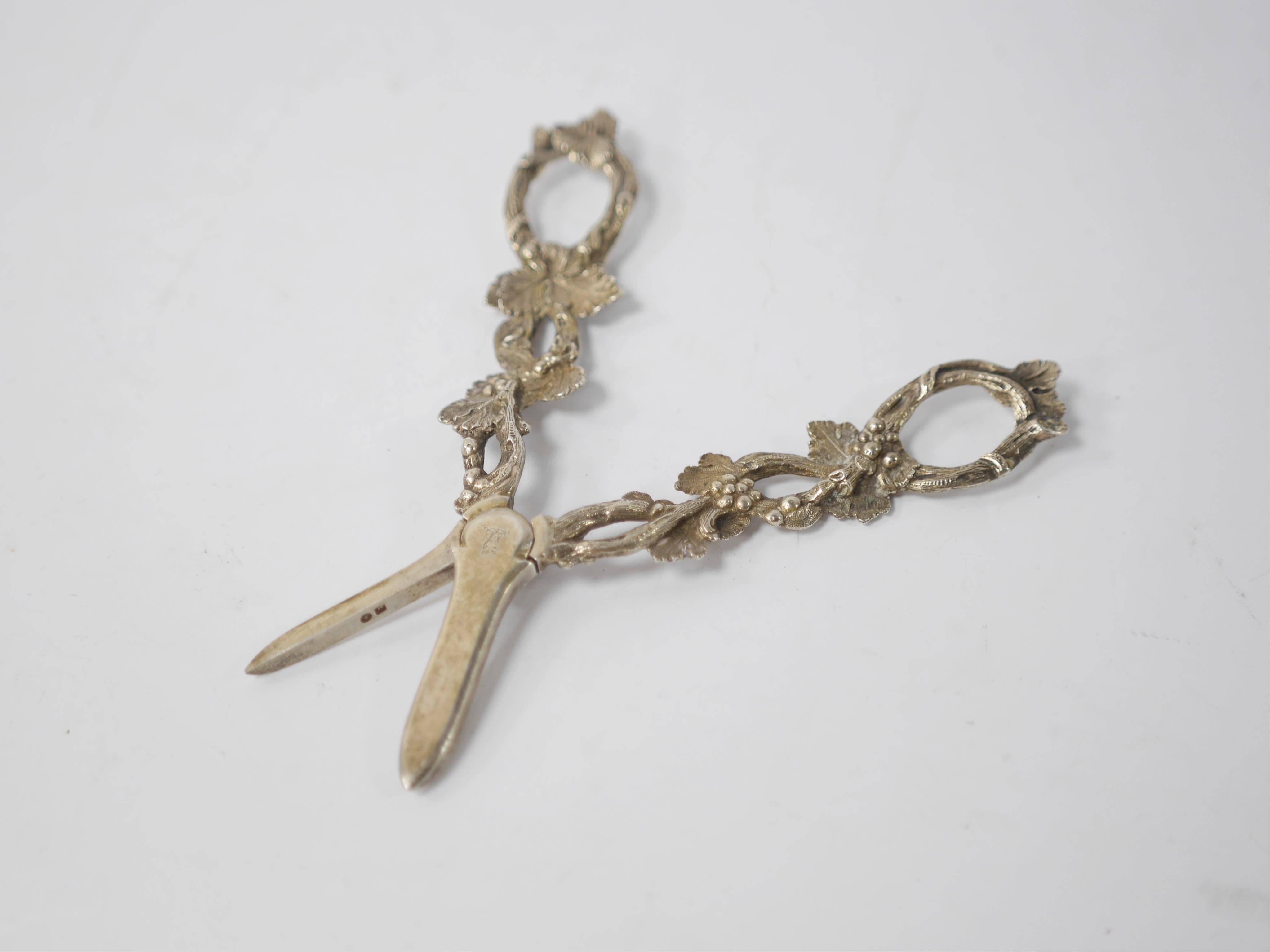 A pair of Victorian silver grape shears with fruiting vine handles, Martin, Hall & Co, Sheffield, 1884, 17.1cm. Condition - good